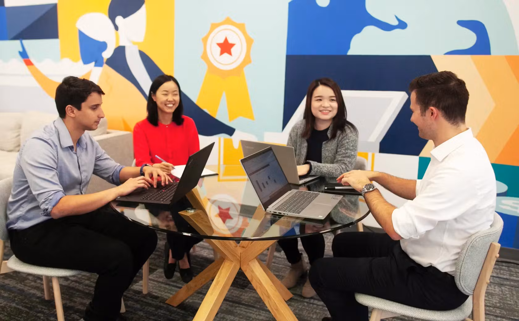 Group of people working together at a desk
